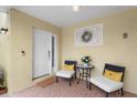 Inviting front porch features comfortable seating and stylish decor, perfect for relaxing at 423 Shaddock St, Tarpon Springs, FL 34689