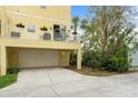 Spacious garage with an upstairs balcony area, offering ample parking and outdoor space at 423 Shaddock St, Tarpon Springs, FL 34689