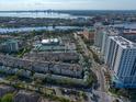 Stunning aerial view of Harbour Place City Homes with water views and cityscape backdrop at 501 Knights Run Ave # 2101, Tampa, FL 33602