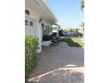 Exterior view of home's brick driveway with an area for seating near the front window at 9480 45Th N Way, Pinellas Park, FL 33782