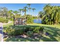 Belleview Biltmore Villas sign with lush landscaping and serene waterfront view at 100 Oakmont Ln # 112, Belleair, FL 33756
