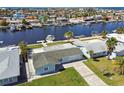 Waterfront home with lush landscaping and private dock access to channel, plus city and ocean views at 5321 Bowline Bnd, New Port Richey, FL 34652