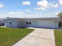Charming one-story home with a well-manicured lawn and a spacious two-car garage at 5321 Bowline Bnd, New Port Richey, FL 34652