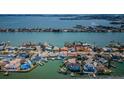 Beautiful aerial view of waterfront property with stunning water views surrounding the home at 5815 Bali S Way, St Pete Beach, FL 33706