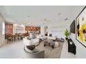 Spacious open-concept living room and dining area with modern decor and plenty of natural light at 7010 Old Benton Dr, Apollo Beach, FL 33572