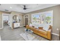 Cozy living room featuring natural light, neutral decor and tiled floors at 14066 Marguerite Dr, Madeira Beach, FL 33708
