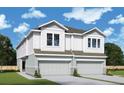 Charming two-story townhome featuring a white exterior and a two-car garage at 3021 W Ballast Pt # 2, Tampa, FL 33611
