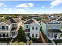 Aerial shot shows a well-maintained neighborhood with a clear view of the light blue home at 6157 Castleton Hollow Rd, Riverview, FL 33578