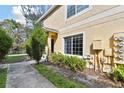 Inviting two-story townhome with manicured shrubs and a well-kept front yard at 10814 Brickside Ct, Riverview, FL 33579