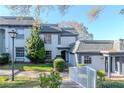Well-manicured home with lush landscaping and a welcoming walkway leading to the front door at 1321 N Mcmullen Booth Rd # 1321, Clearwater, FL 33759