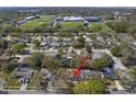 Real estate aerial view showing the location of a home with surrounding neighborhood amenities at 1582 Sandalwood Dr, Dunedin, FL 34698