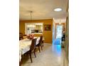 Cozy dining room with a view into the kitchen and direct access to the front door at 1616 S Lake Ave # 4, Clearwater, FL 33756