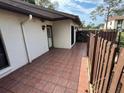 The unit has a private and sunny patio with tile floors at 1725 Pine Ridge E Way # C, Palm Harbor, FL 34684