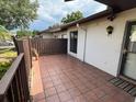Private tiled patio area perfect for outdoor relaxing and entertaining at 1725 Pine Ridge E Way # C, Palm Harbor, FL 34684