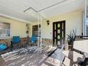 Inviting front porch with tiled flooring and cozy seating at 3501 Beechwood N Ter, Pinellas Park, FL 33781