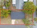 Birds-eye view of home featuring lush landscape, grassy yard and modern roof at 6232 Jackson St, New Port Richey, FL 34653