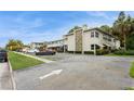 Exterior view of the Park View Condo showcasing manicured grounds and nearby parking at 800 71St N Ave # 8, St Petersburg, FL 33702
