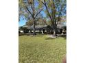 Charming single-story home with mature trees, and well-maintained landscaping at 860 Glen More Ct # B, Palm Harbor, FL 34684