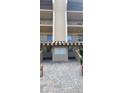 An inviting entrance with a striped awning, mailboxes, and brick pavers at 90 S Highland Ave # 224, Tarpon Springs, FL 34689