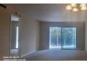 Bright and airy living room with sliding glass doors leading to a balcony at 90 S Highland Ave # 224, Tarpon Springs, FL 34689