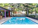 Enclosed swimming pool with brickwork and exterior seating, perfect for entertaining guests at 903 Setter Ct, Seffner, FL 33584