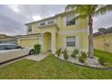 Charming two-story home boasts a well-manicured lawn, a two-car garage, and a welcoming entrance at 10730 Shady Preserve Dr, Riverview, FL 33579