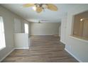 Spacious living room showcasing new hardwood floors and neutral color palette, perfect for relaxation at 10811 Brickside Ct, Riverview, FL 33579
