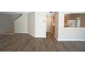 Bright living room featuring stylish new hardwood flooring throughout the space at 10811 Brickside Ct, Riverview, FL 33579