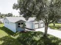 A view of a light-colored single-Gathering home from an elevated position at 14330 Channel Dr, Largo, FL 33774