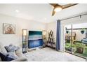 Bright living room with sliding glass doors leading to an outdoor seating area and a fun playhouse at 1881 N Hercules Ave # 1205, Clearwater, FL 33765