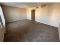Spacious living room with neutral carpet, ceiling fan, and ample natural light at 2449 Columbia Dr # 29, Clearwater, FL 33763