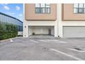 Attached, two-car garage with an open door at 4810 W Mcelroy Ave # 7, Tampa, FL 33611