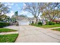 Well-maintained one-story home with a spacious driveway and attached two-car garage at 503 Old Grove Dr, Lutz, FL 33548