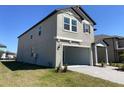 Two-story home with a two car garage, neat landscaping, and an irrigation system at 7105 119Th E Ct, Palmetto, FL 34221