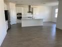 Spacious kitchen featuring stainless steel appliances, a large island, and tile floors at 7105 119Th E Ct, Palmetto, FL 34221
