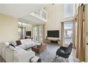 Bright living room boasting vaulted ceilings, lots of natural light, and modern furnishings at 7200 Ulmerton Rd # B4, Largo, FL 33771