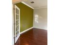 Bright office space featuring hardwood floors, neutral walls, and glass French doors at 11648 Palmetto Pine St, Riverview, FL 33569