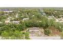 Aerial shot featuring a home surrounded by a dense forest, highlighting the privacy and natural setting at 12651 Tinley Rd, New Port Richey, FL 34654