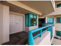 Condo hallway featuring unit entrance with double doors and a small sitting area with windows at 1520 Gulf Blvd # 805, Clearwater Beach, FL 33767