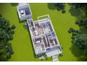 Open-concept floor plan showcasing spacious living areas, a modern kitchen, and a detached two-car garage at 2402 N Glenwood Dr, Tampa, FL 33602