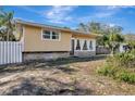 Charming one-story home with a large front window and stone accents at 4716 Gazania St, New Port Richey, FL 34652
