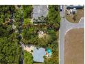 Aerial view of lot surrounded by trees and nearby homes, showcasing the location's proximity to residential areas at 5218 Winding Way, Sarasota, FL 34242