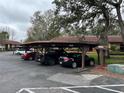 Convenient covered parking area with ample spaces for residents and visitors at 8550 Shadblow Ct # 2, Port Richey, FL 34668