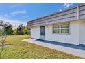 Charming exterior view of home featuring a low-maintenance yard, door and window trim, and a sidewalk at 206 Andover N Pl # 96, Sun City Center, FL 33573
