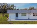 Charming exterior view of home featuring a low-maintenance yard, door and window trim, and a sidewalk at 206 Andover N Pl # 96, Sun City Center, FL 33573