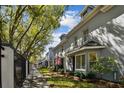 Street view of the townhome, featuring a well-manicured lawn and exterior paint at 2515 S Ysabella Ave, Tampa, FL 33629