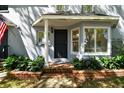 Charming home featuring a well manicured lawn, bay windows, and a covered porch at 2515 S Ysabella Ave, Tampa, FL 33629