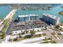 An aerial view of the condo and waterway with plenty of available parking at 500 Treasure Island Cswy # 402, Treasure Island, FL 33706