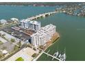 An aerial view showing the condos, surrounding waterway, and boat docks at 500 Treasure Island Cswy # 402, Treasure Island, FL 33706