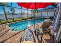 Inviting screened-in pool area featuring brick pavers and comfortable lounge chairs, perfect for relaxing and enjoying the Florida sunshine at 632 Addison Ne Dr, St Petersburg, FL 33716